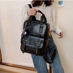 H916c1ffd5b434556aa04152d688a6714Z_b1d08b36-ecf9-4556-af17-5dc09d56ce49.jpg Sac à dos simili cuir noir étudiant aspect sacoche