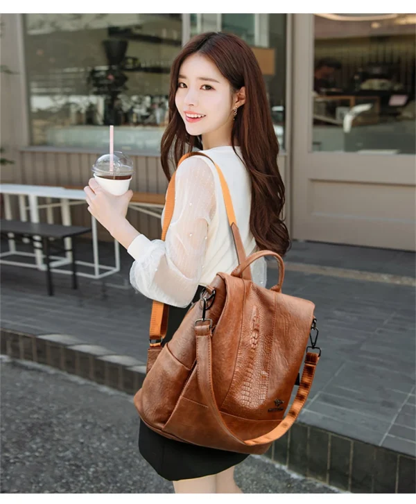 S0e7248a42e1a470493b896cad7e3b49cs.webp Sac à dos pour femme en cuir effet croco