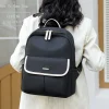 S8b1c8b61b96c4961a7cb133e774d21e3o.webp Sac à dos en nylon grande capacité pour femme