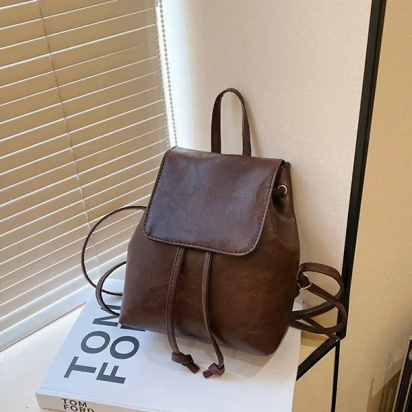 S9c2d9975007745729281a89d2619f6d5j.webp Sac à dos vintage en similicuir avec cordon