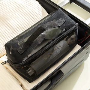 trousse_de_toilette_ouverture_grand_angle_pos__sur_une_valise.jpg Trousse de Toilette Ouverture Grand Angle